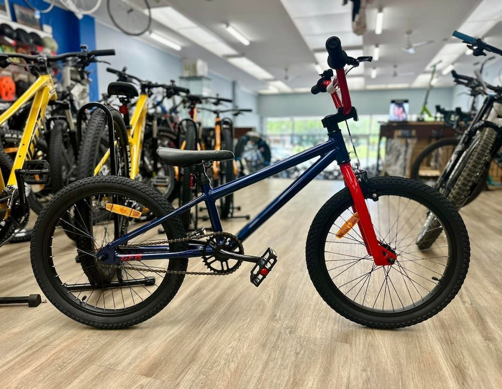 Navy and red BMX bike in a bike shop — Grafton City Cycles in Grafton, NSW