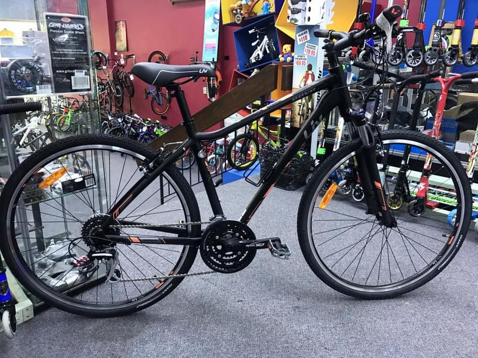 Black hybrid bicycle on display in a bike shop — Grafton City Cycles in Grafton, NSW
