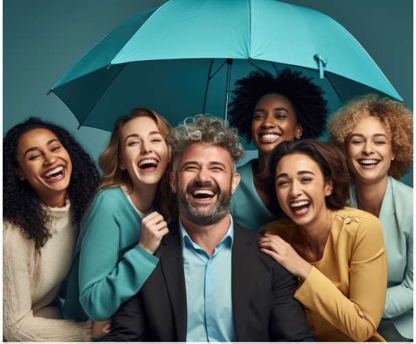 A group of people are laughing under an umbrella.
