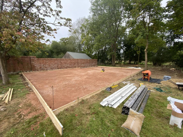 Freshly graded area with materials laid out for building a new sport court during a court installation service in Chandler, AZ