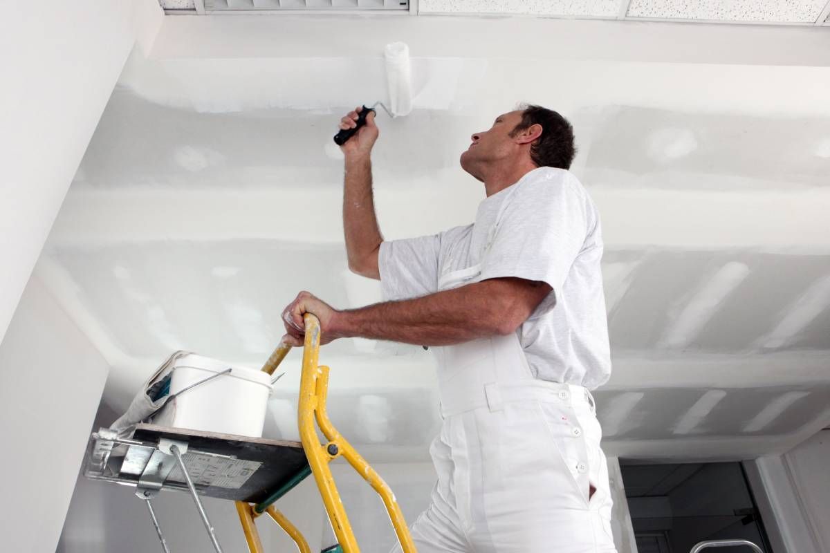 Someone painting a ceiling after they finish painting walls at All About Painting near Johnson City, Tennessee (TN)