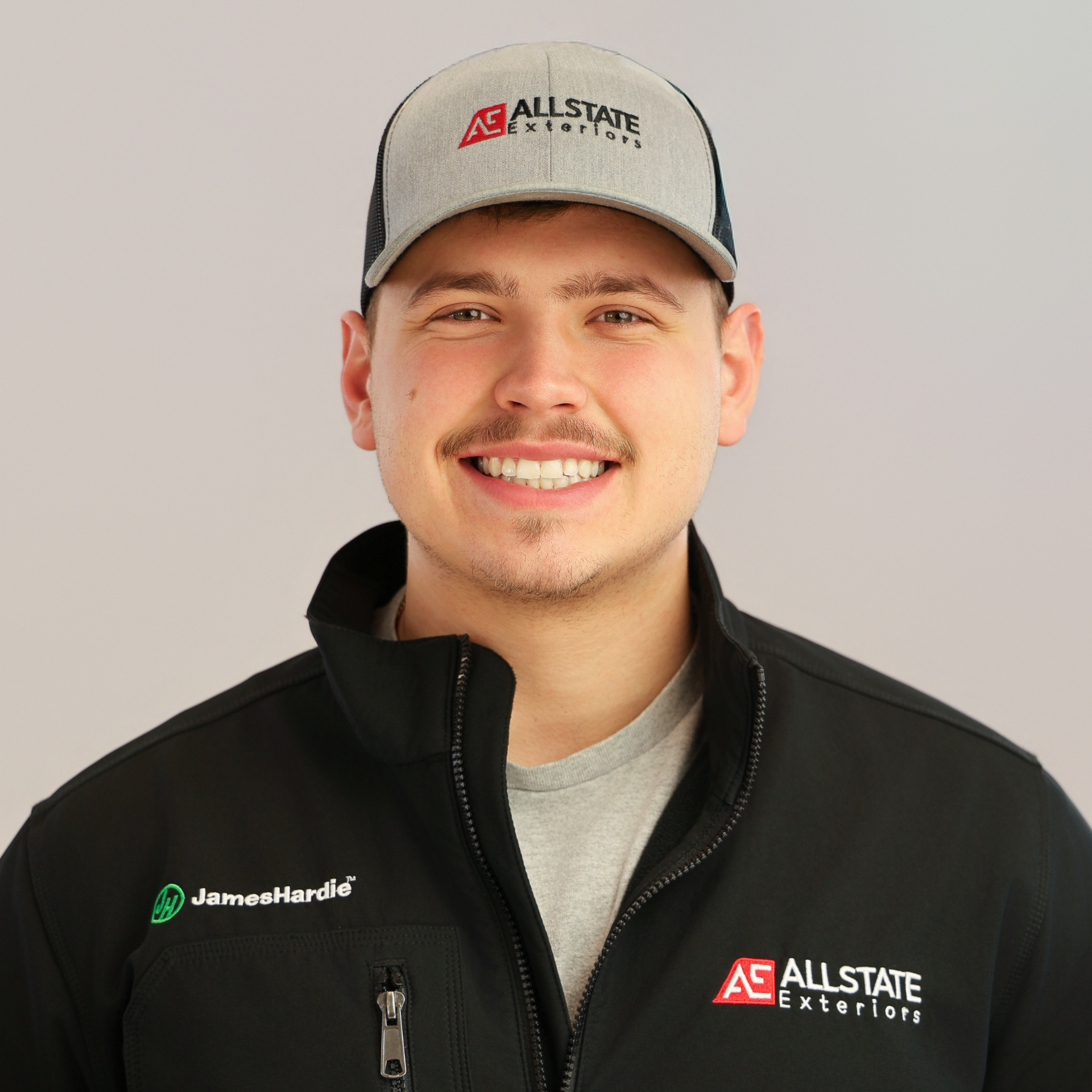 a young man is smiling for the camera