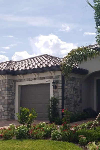 Brick house exterior roofing project completed by Allstate Exteriors and restorations in Fort Meyers, FL.