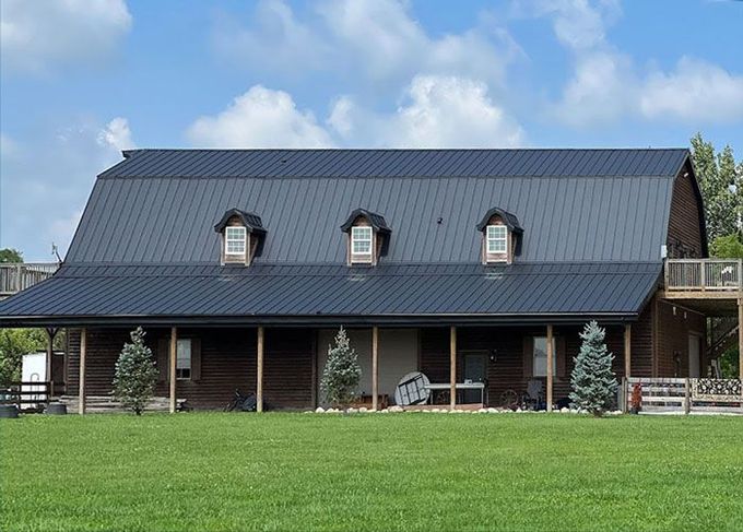 A group of people are working on the roof of a building