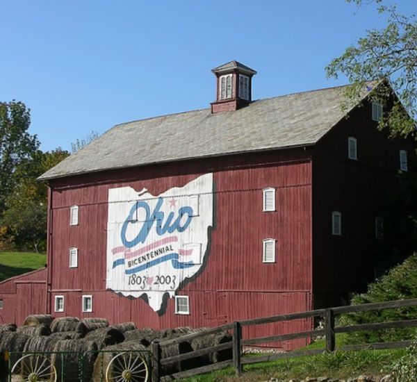 A red barn with the state of ohio painted on it