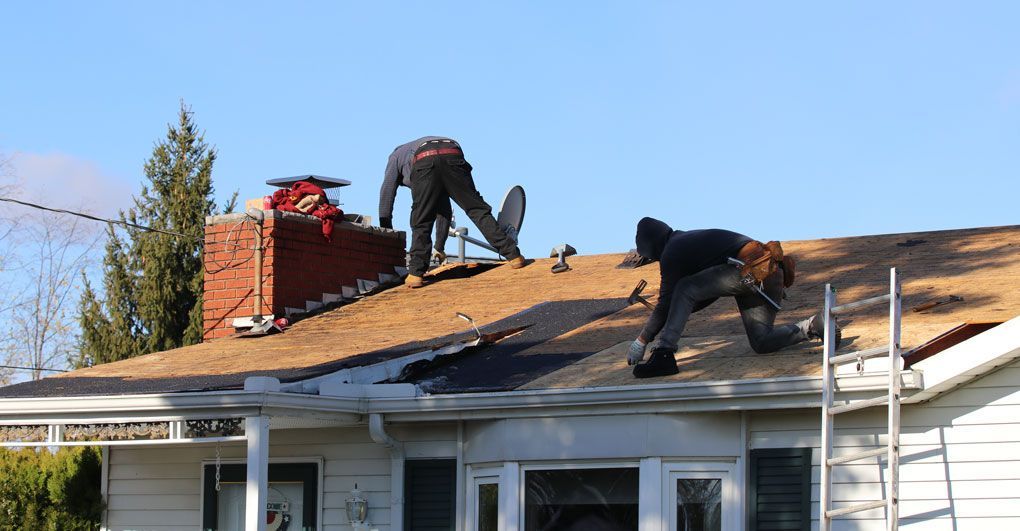 Roof repair work on an Ohio home exterior