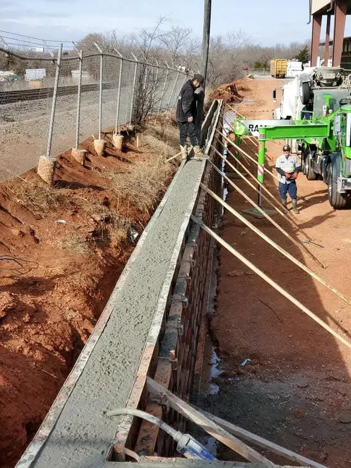 Sixteen gray, square pavers arranged in a four-by-four grid.