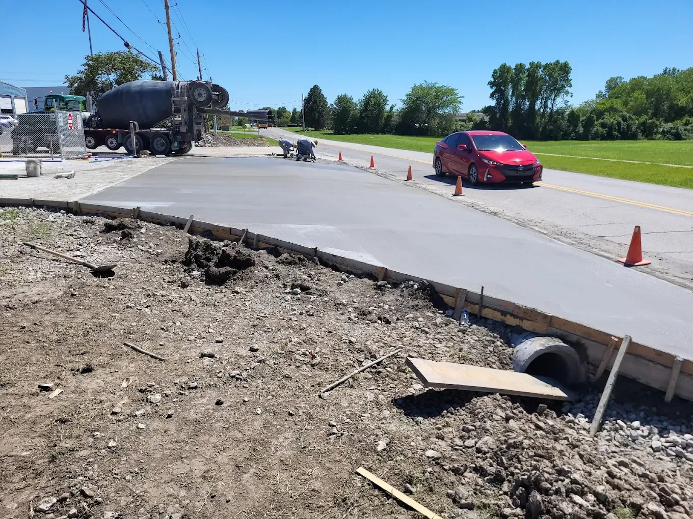 Concrete foundation of a building under construction, with protruding metal rods.