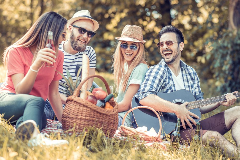 A Group Of Young People Are Having A Picnic In The Park — Moreability In Southport, QLD