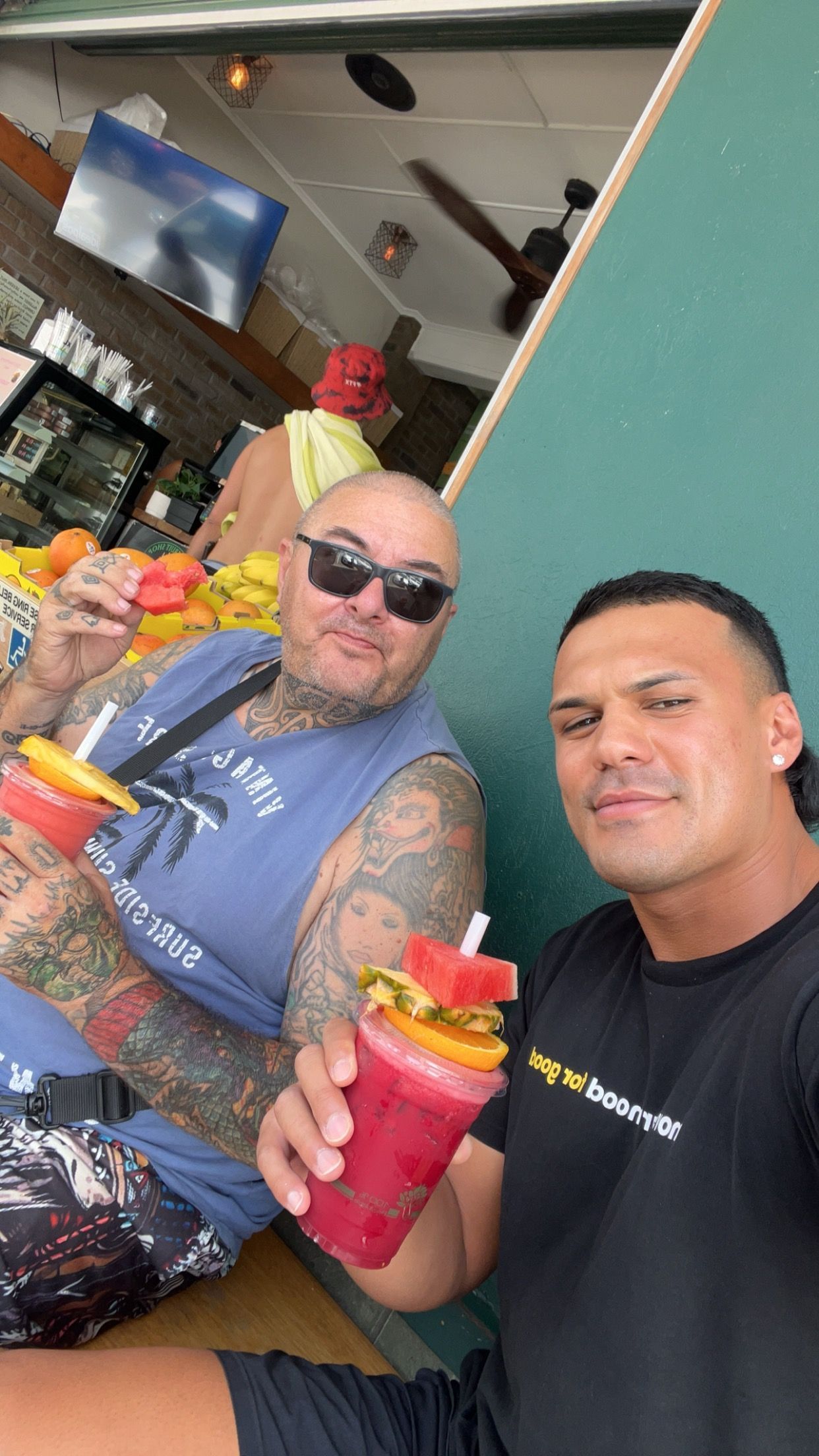 Two Men Having A Fruit Juice Together — Moreability In Southport, QLD