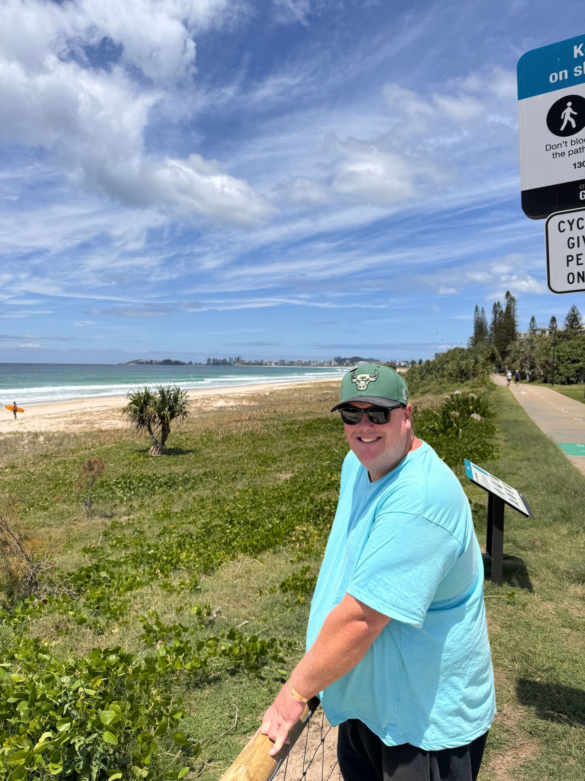 A Man Standing In front Of The Beach On The Grass — Moreability In Southport, QLD