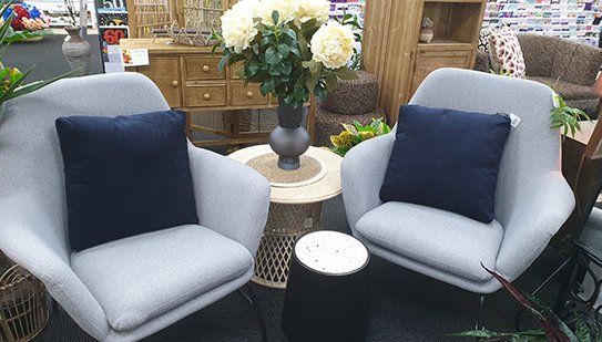 Two Grey Armchairs With Decorative Cushions — Homewares in Alice Springs, NT
