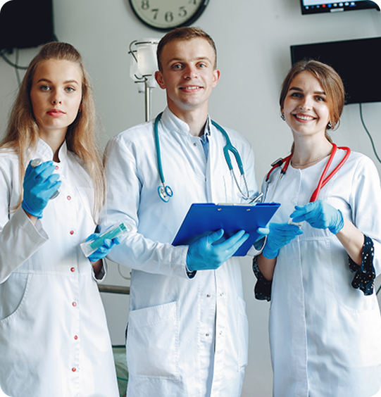 Three medical professionals wearing lab coats, stethoscopes, and gloves.