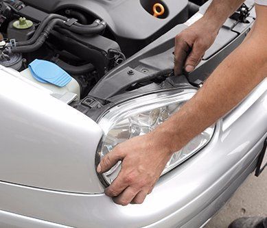 Expert doing the repair work on the automobile