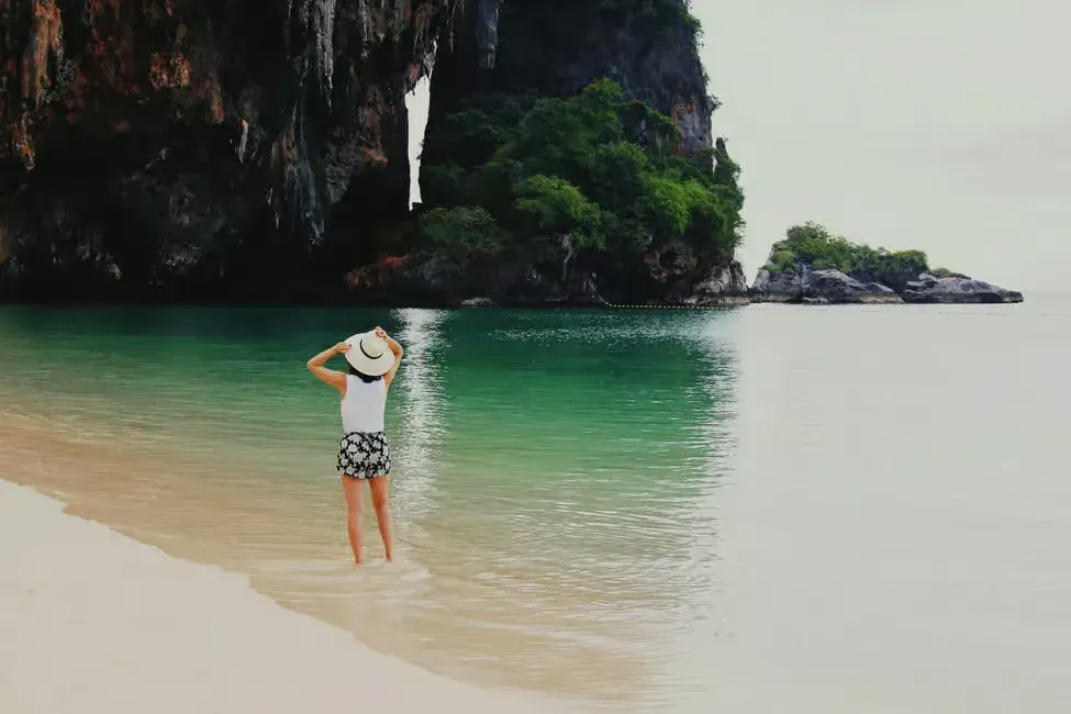 a woman on the beach on one of the islands of 4 islands tour