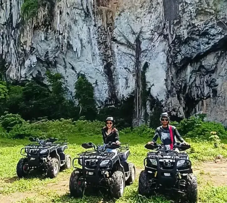 group of people riding atv