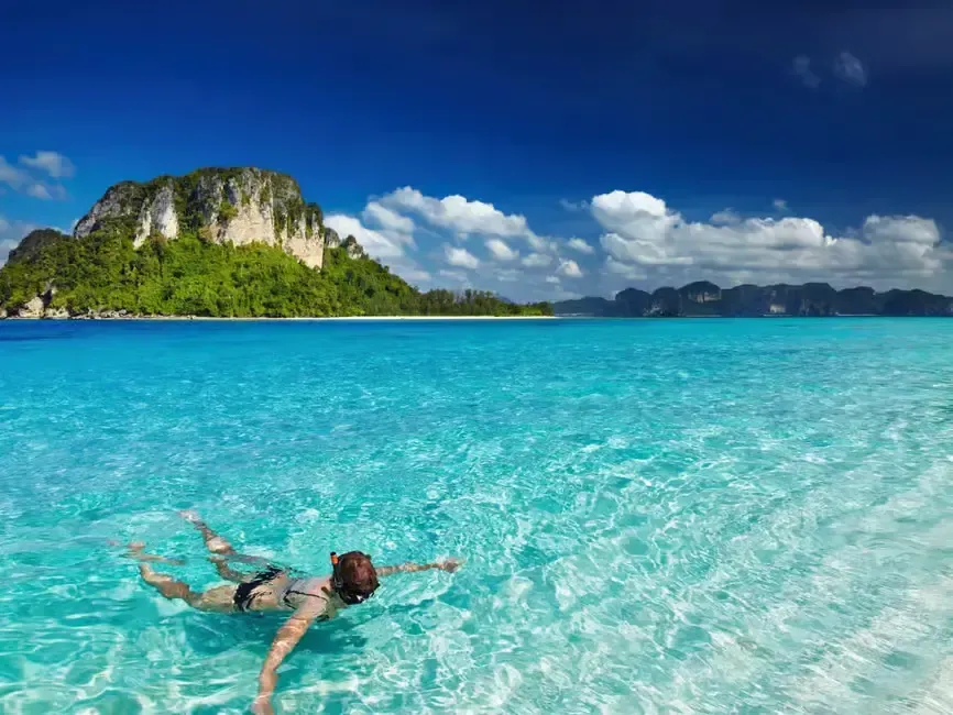 a woman snorkeling in hong island