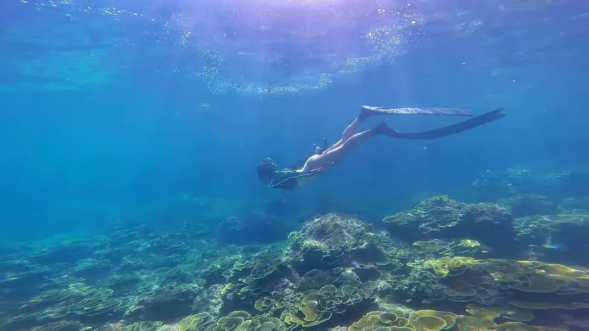 a woman snorkeling