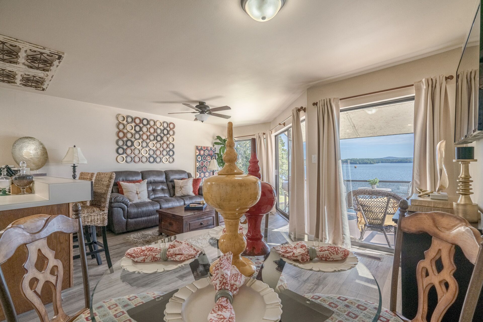 A living room with a table and chairs and a couch.