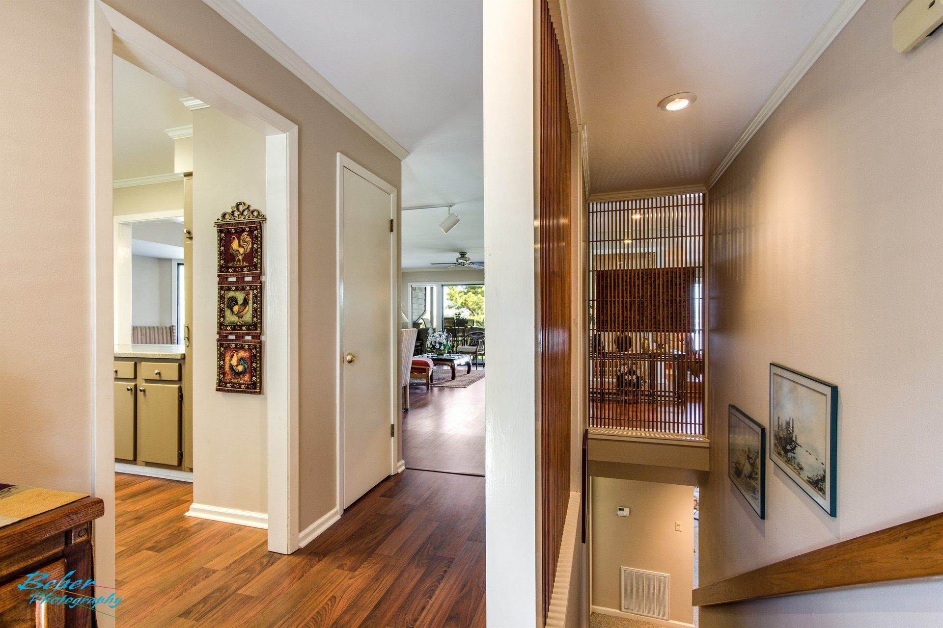 A picture of a hallway and stairs in a house