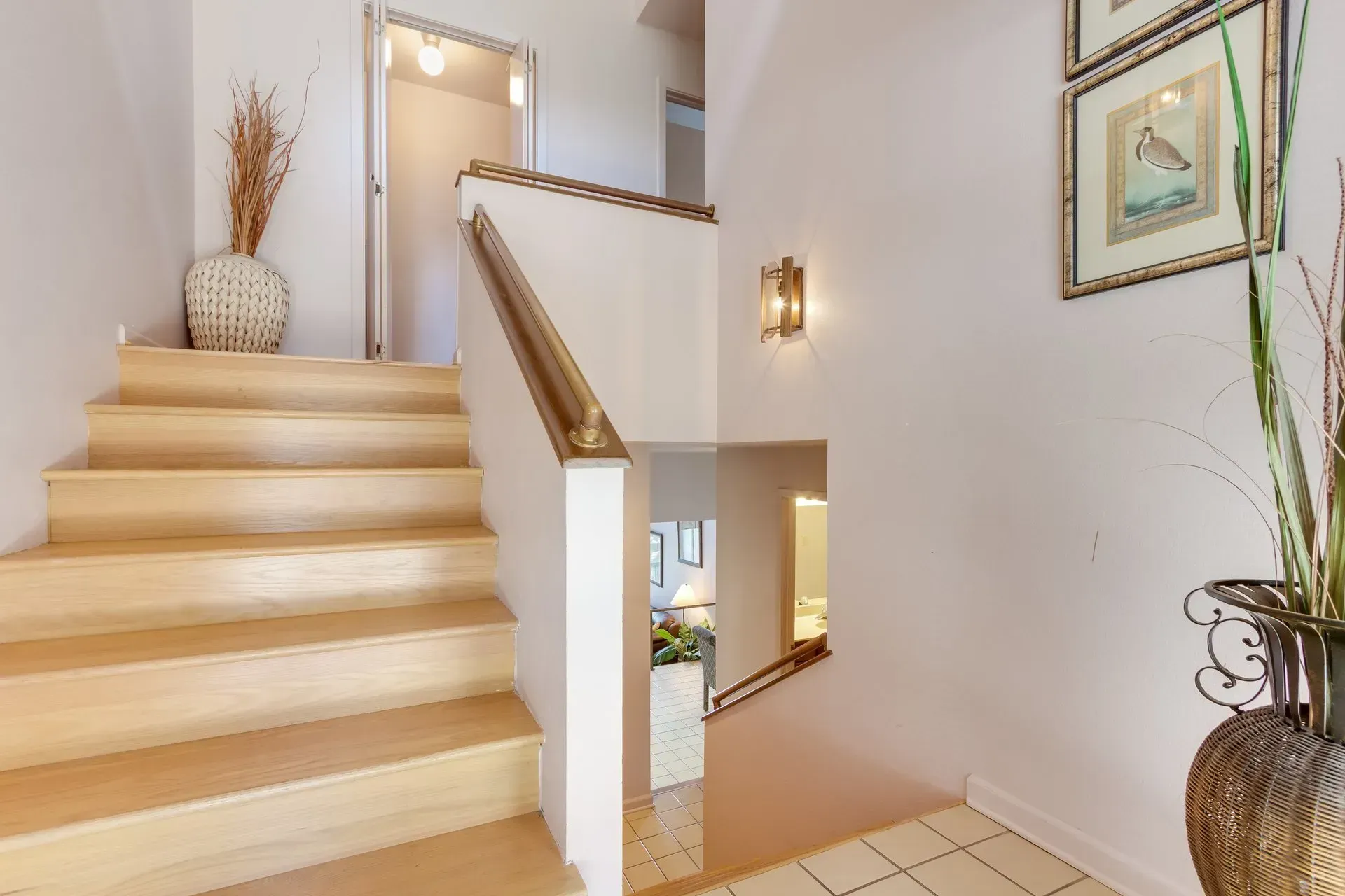 A wooden staircase leading up to the second floor of a house