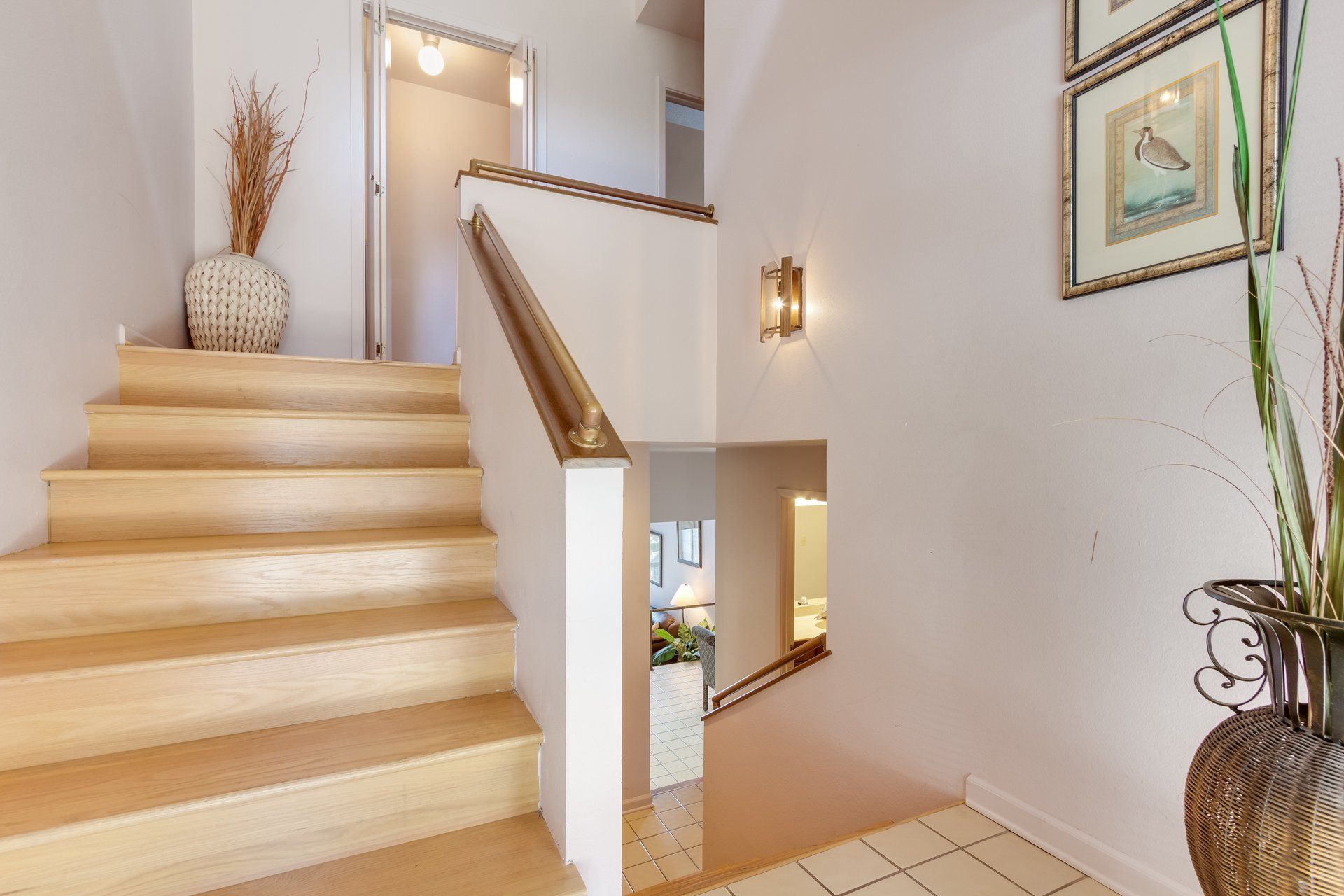 A wooden staircase leading up to the second floor of a house