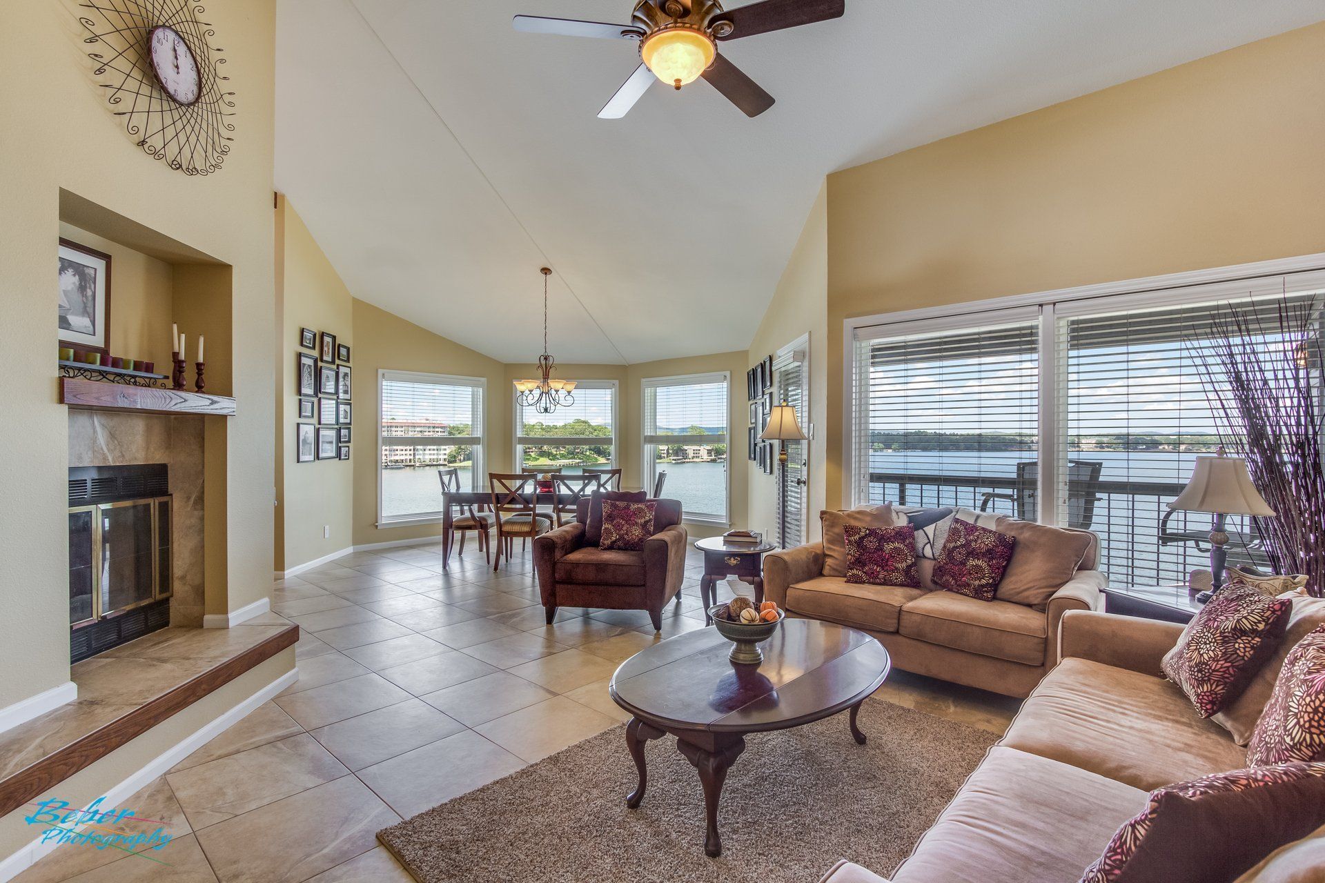 A living room filled with furniture and a ceiling fan