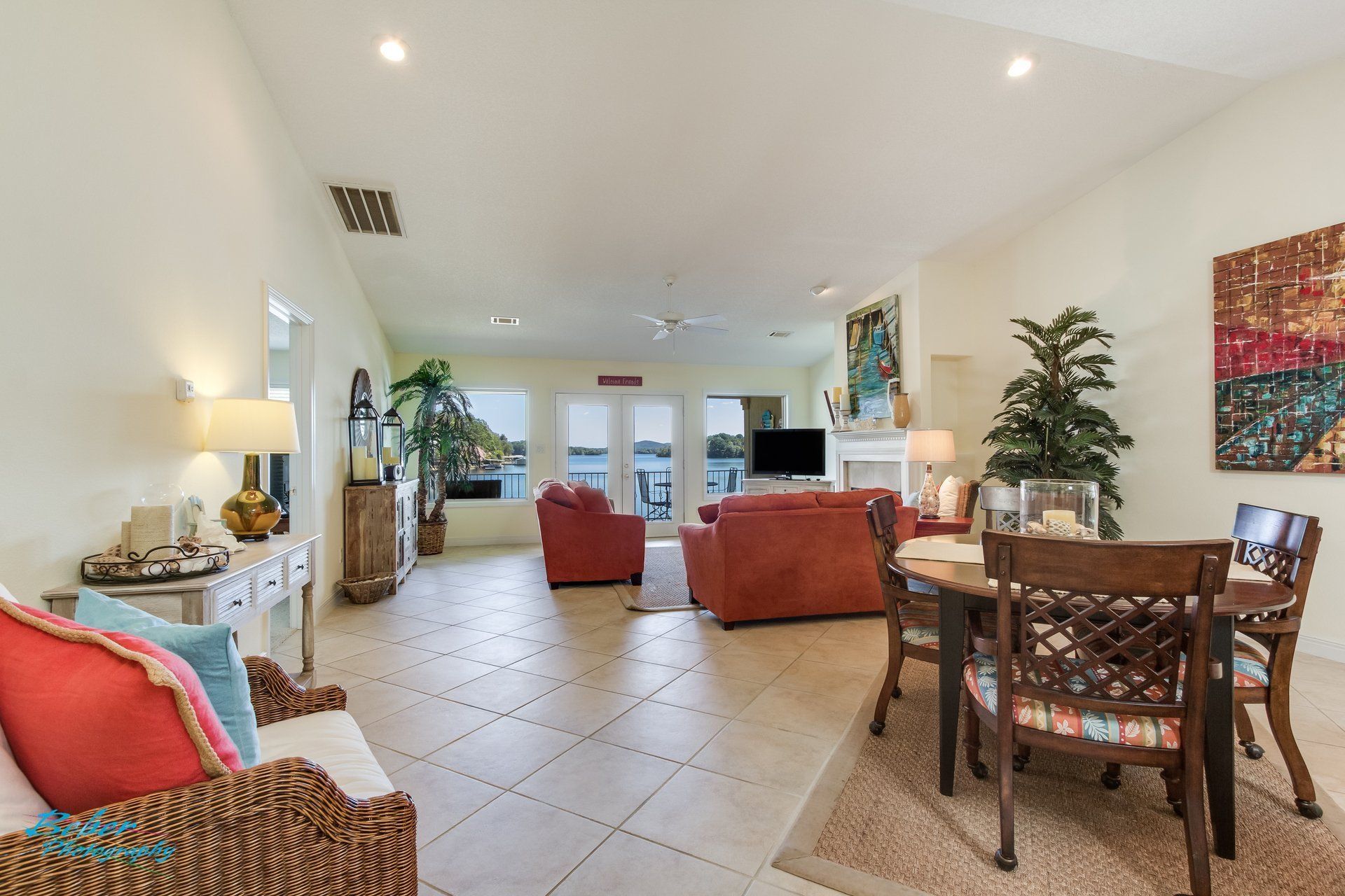 A living room with a dining table and chairs and a couch.