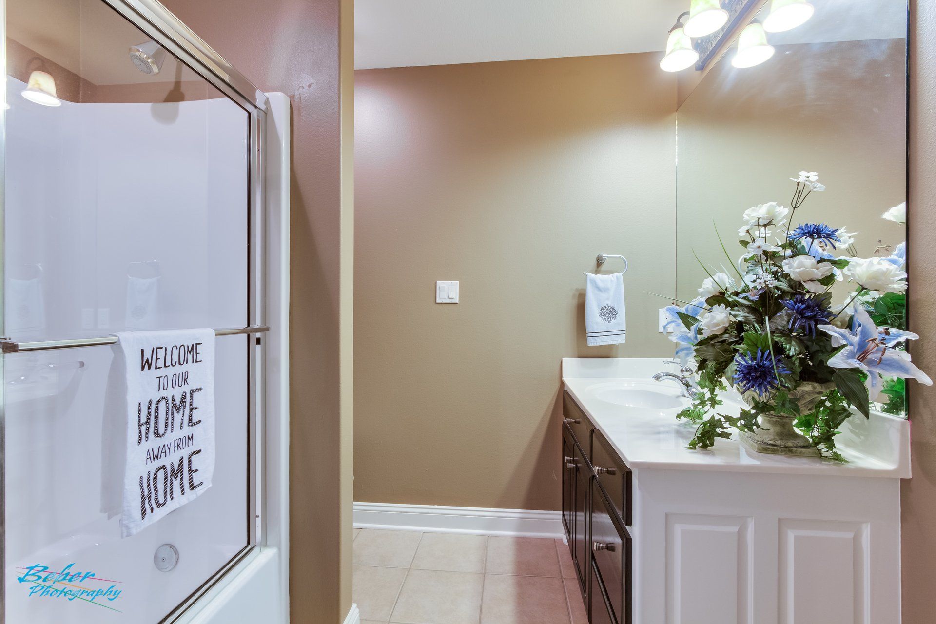 A bathroom with a sign that says welcome to my home