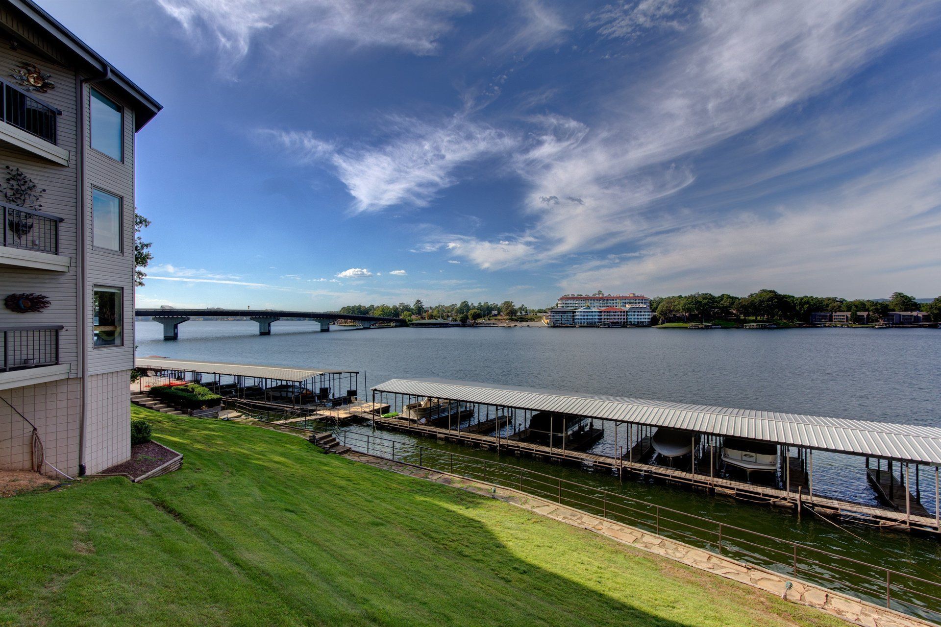 A large body of water with a bridge in the background