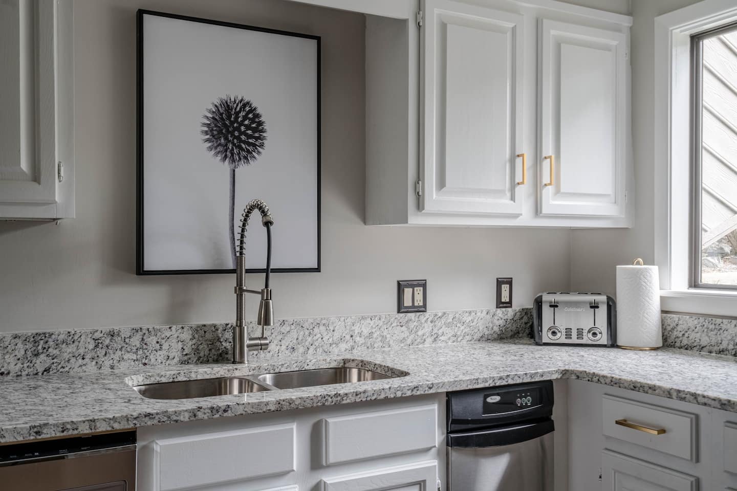 stainless steel kitchen sink in marble countertop