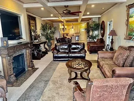 A living room filled with furniture and a fireplace.