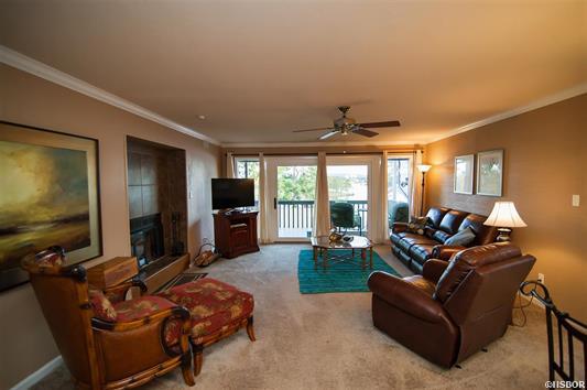 A living room filled with furniture and a television