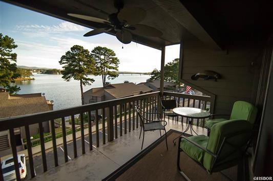 A balcony with a view of a body of water