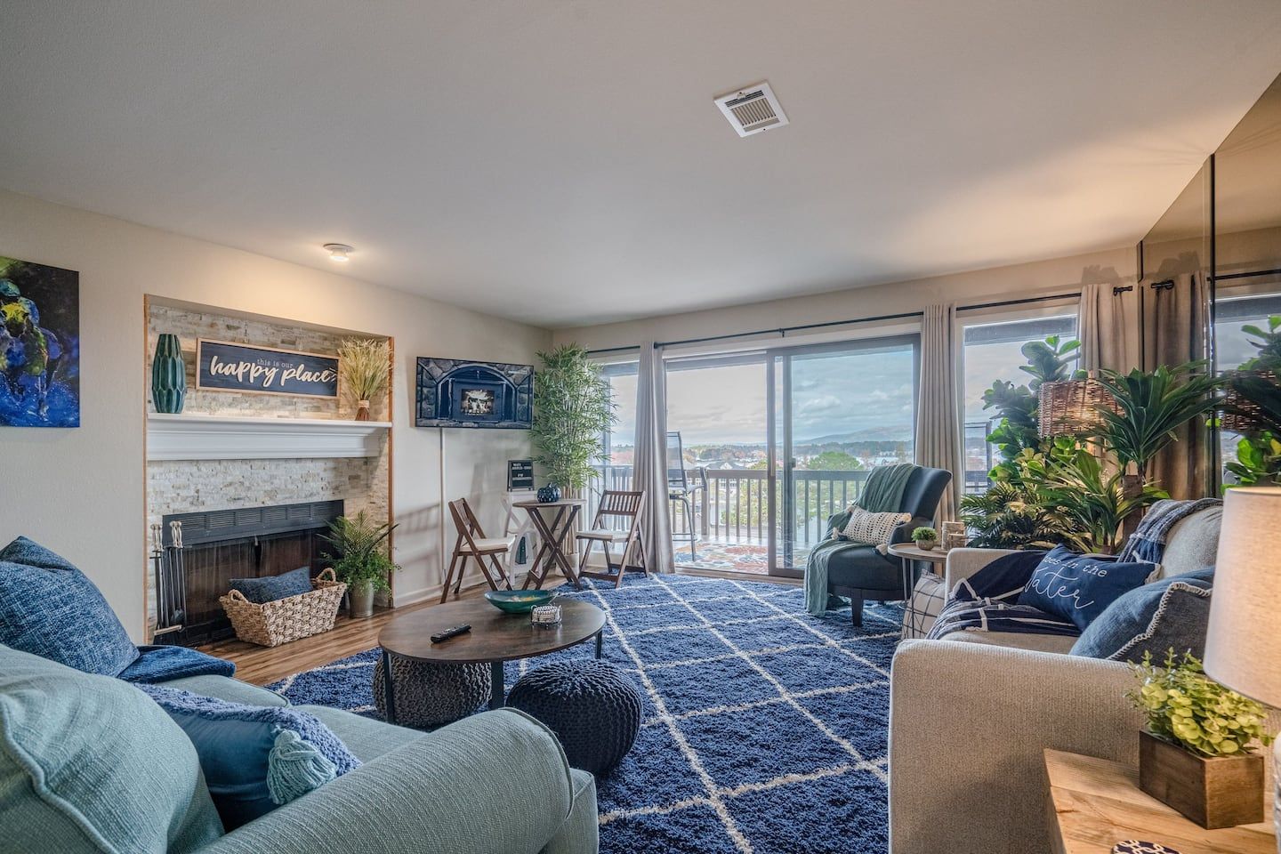 A living room filled with furniture and a fireplace.