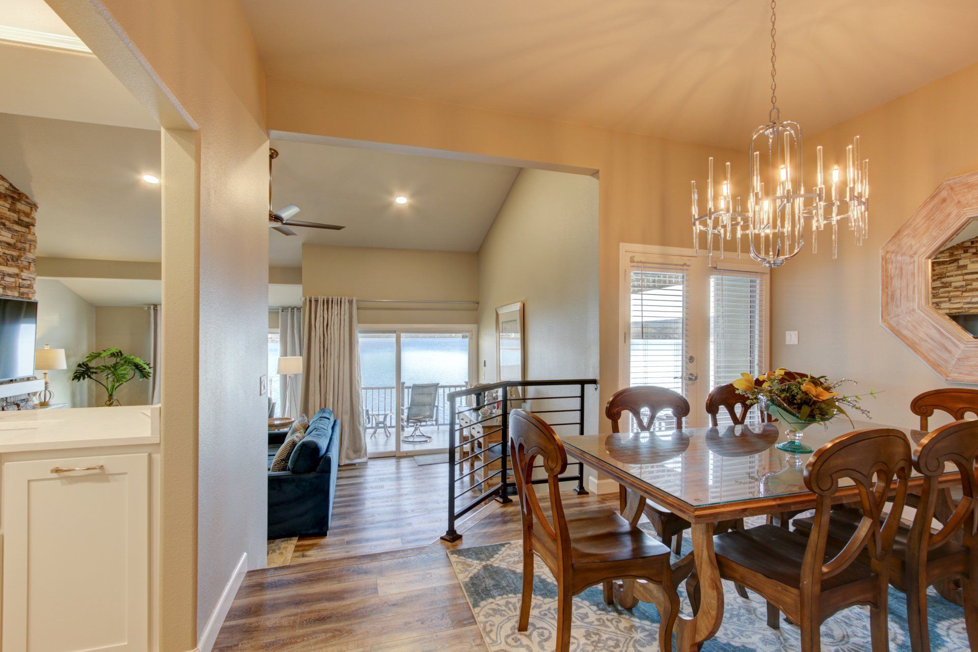 A dining room with a table and chairs and a chandelier.