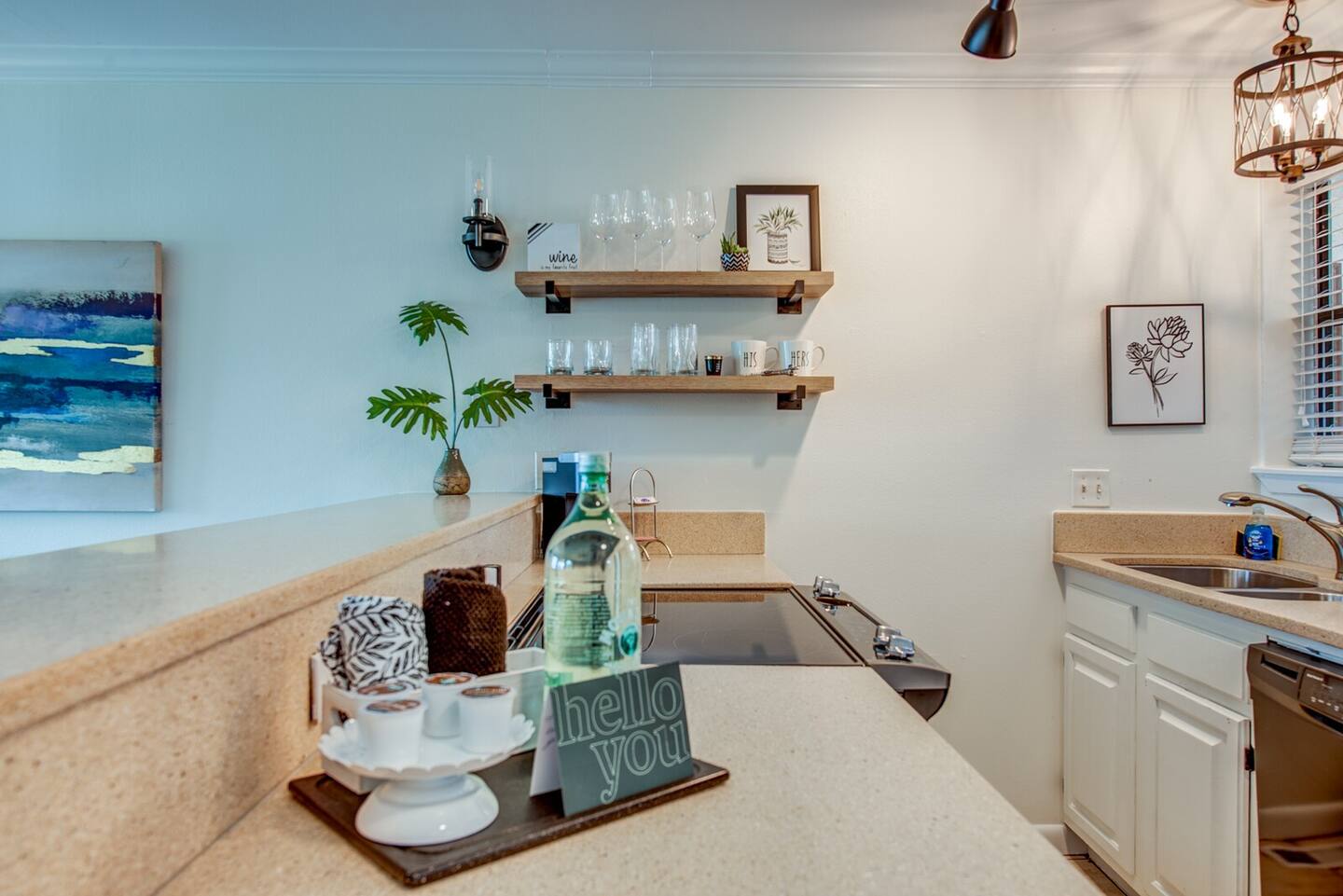 A kitchen with a sign on the counter that says `` hello you ''.
