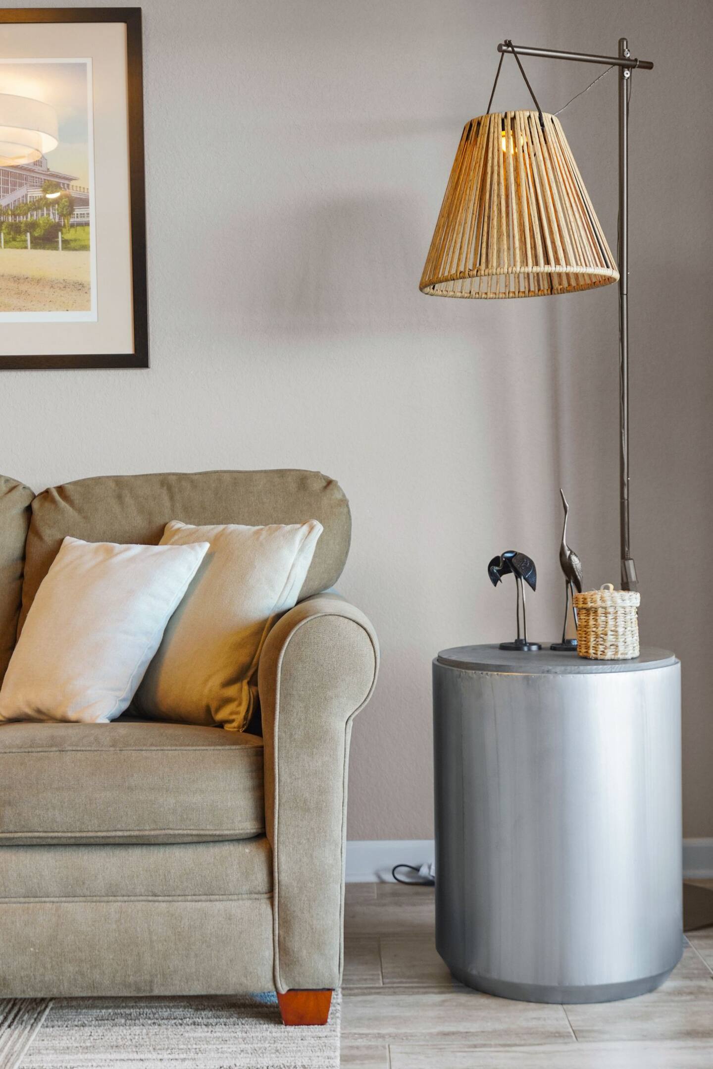 A living room with a couch and a lamp