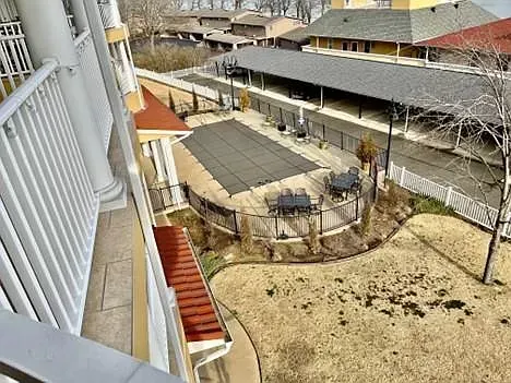 An aerial view of a patio area with umbrellas and tables.