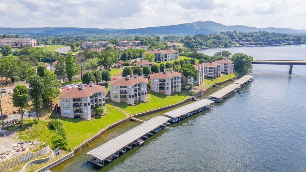 An aerial view of a residential area next to a lake.