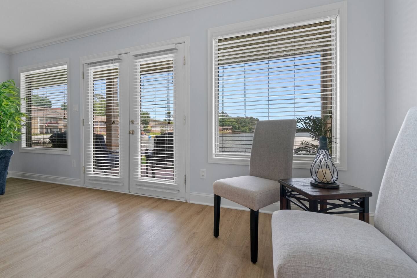 There is a chair and a table in the room.