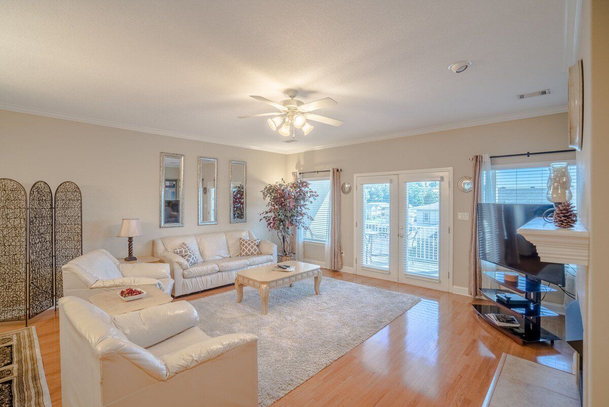 A living room filled with furniture and a television.