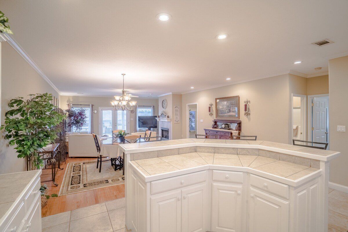 There is a large island in the middle of the kitchen.