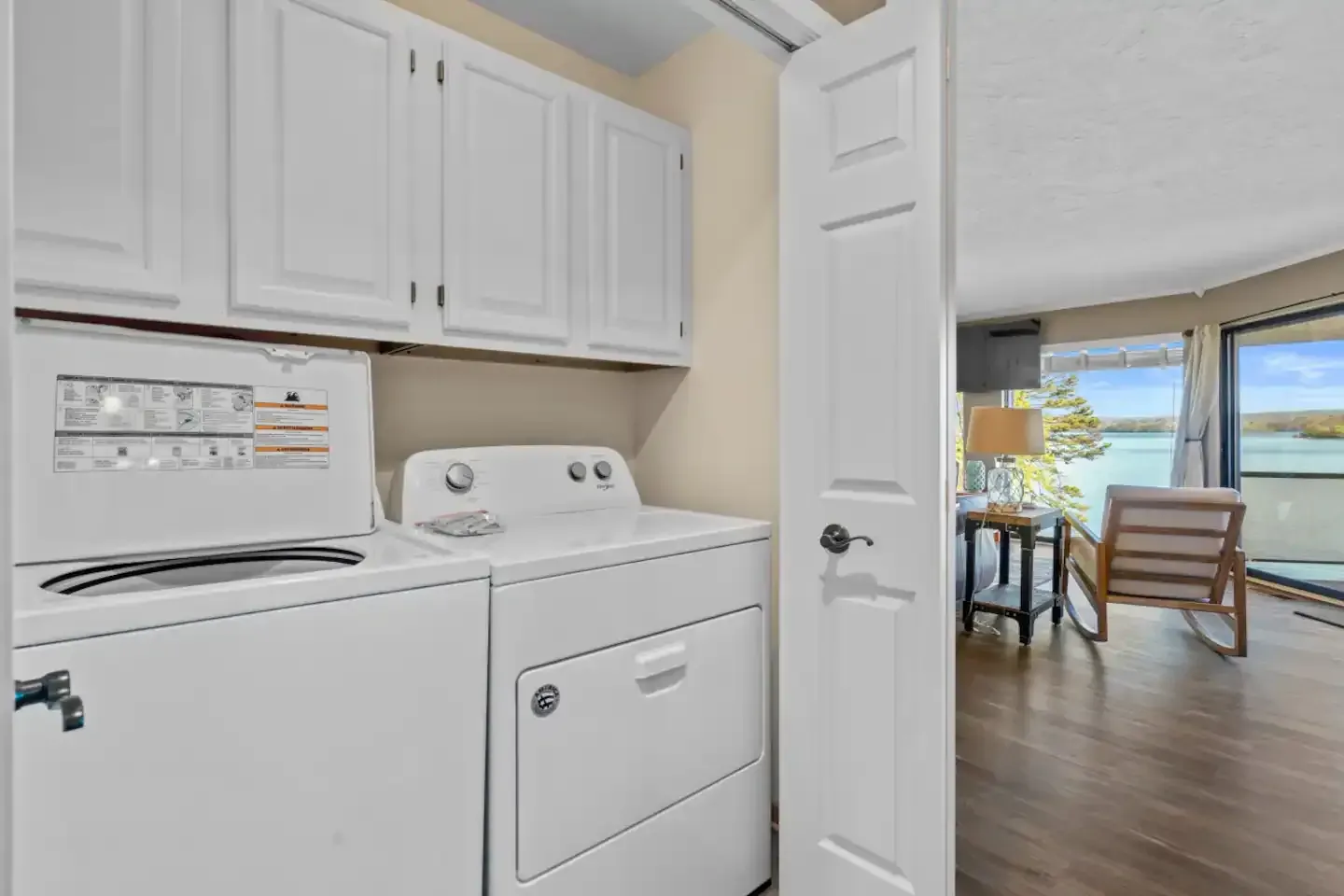 A laundry room with a washer and dryer in a house.