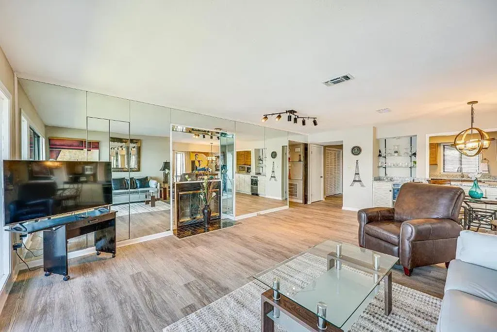 A living room filled with furniture and a flat screen tv.