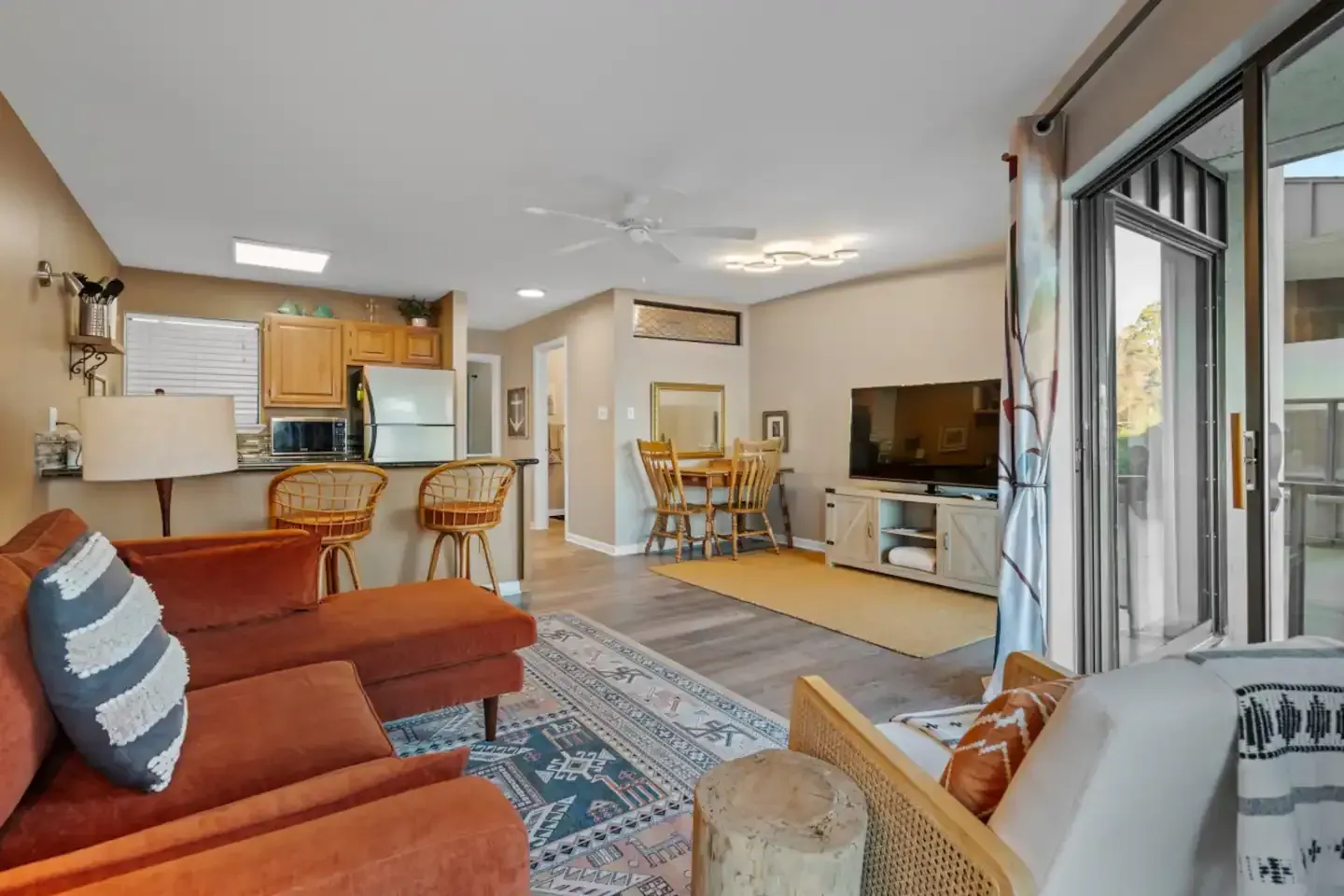A living room filled with furniture and a flat screen tv.