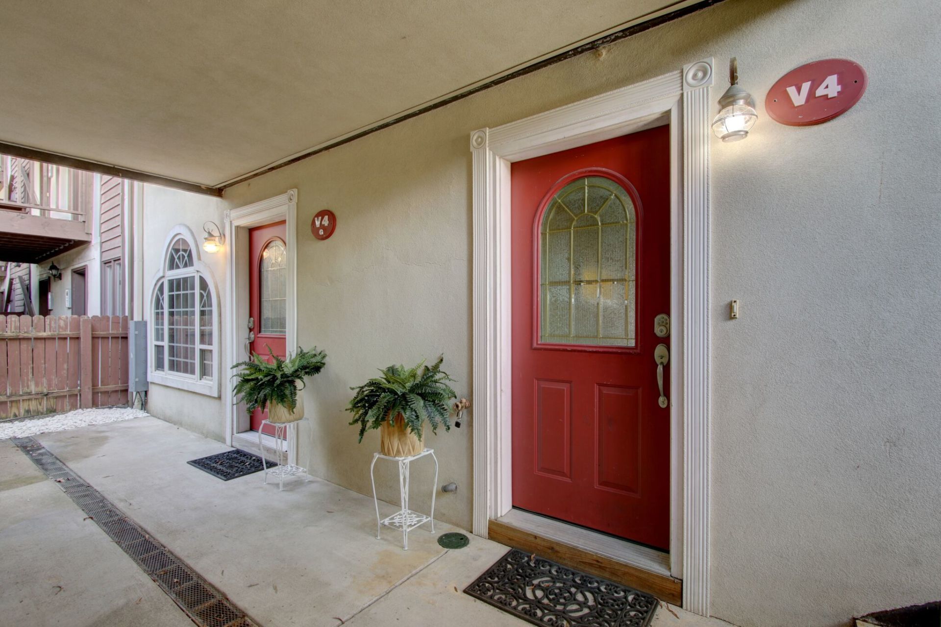 A house with a red door and a sign that says v4