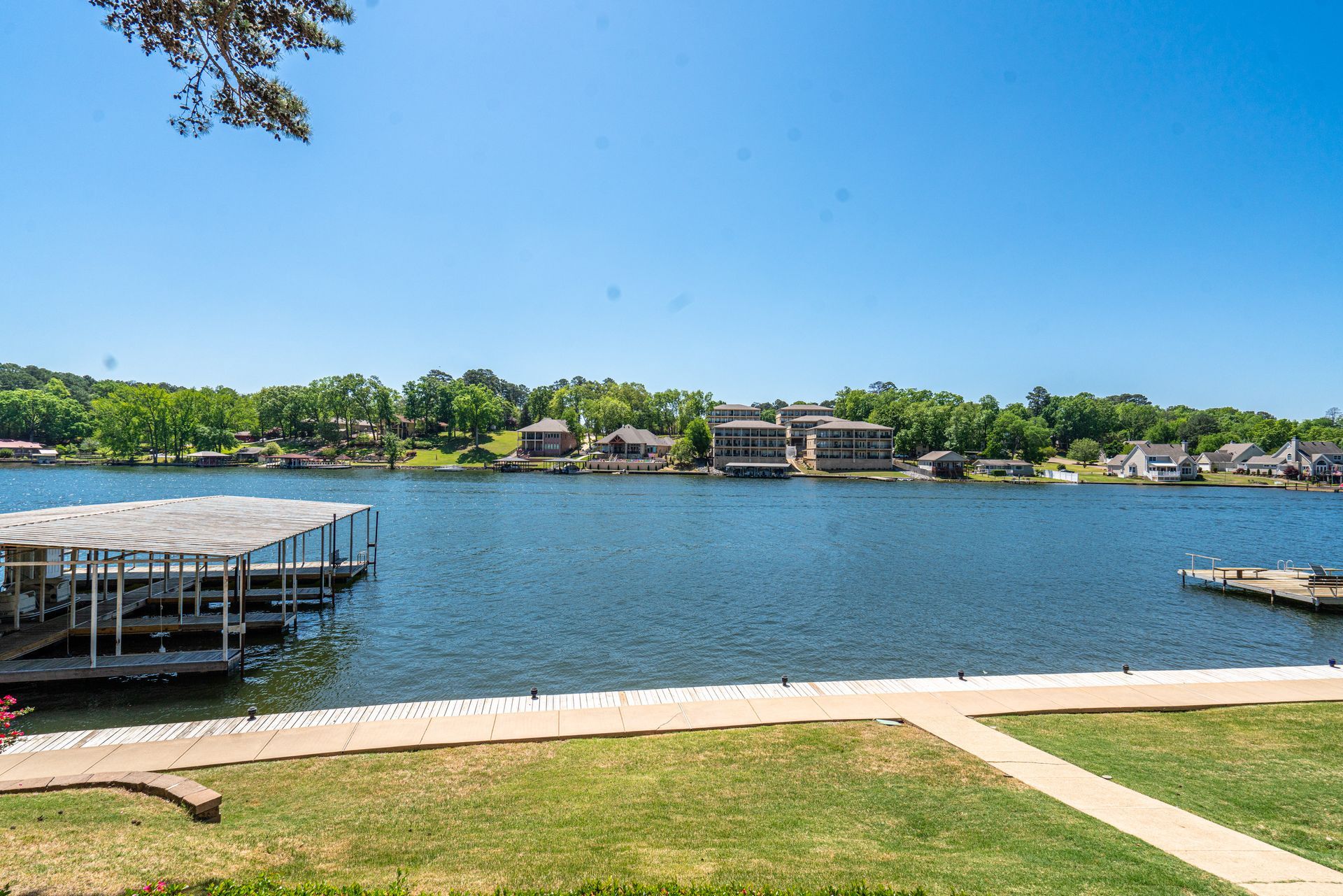 A large body of water with a dock in the middle of it.