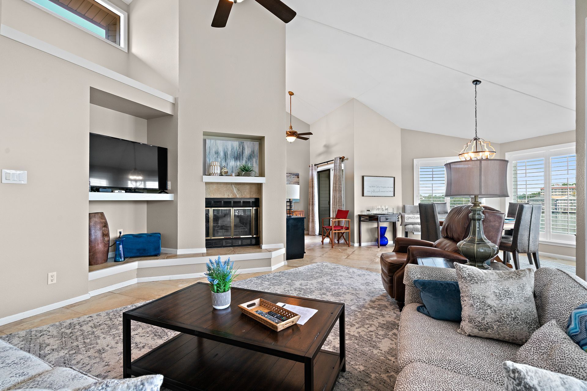 A living room filled with furniture and a ceiling fan.