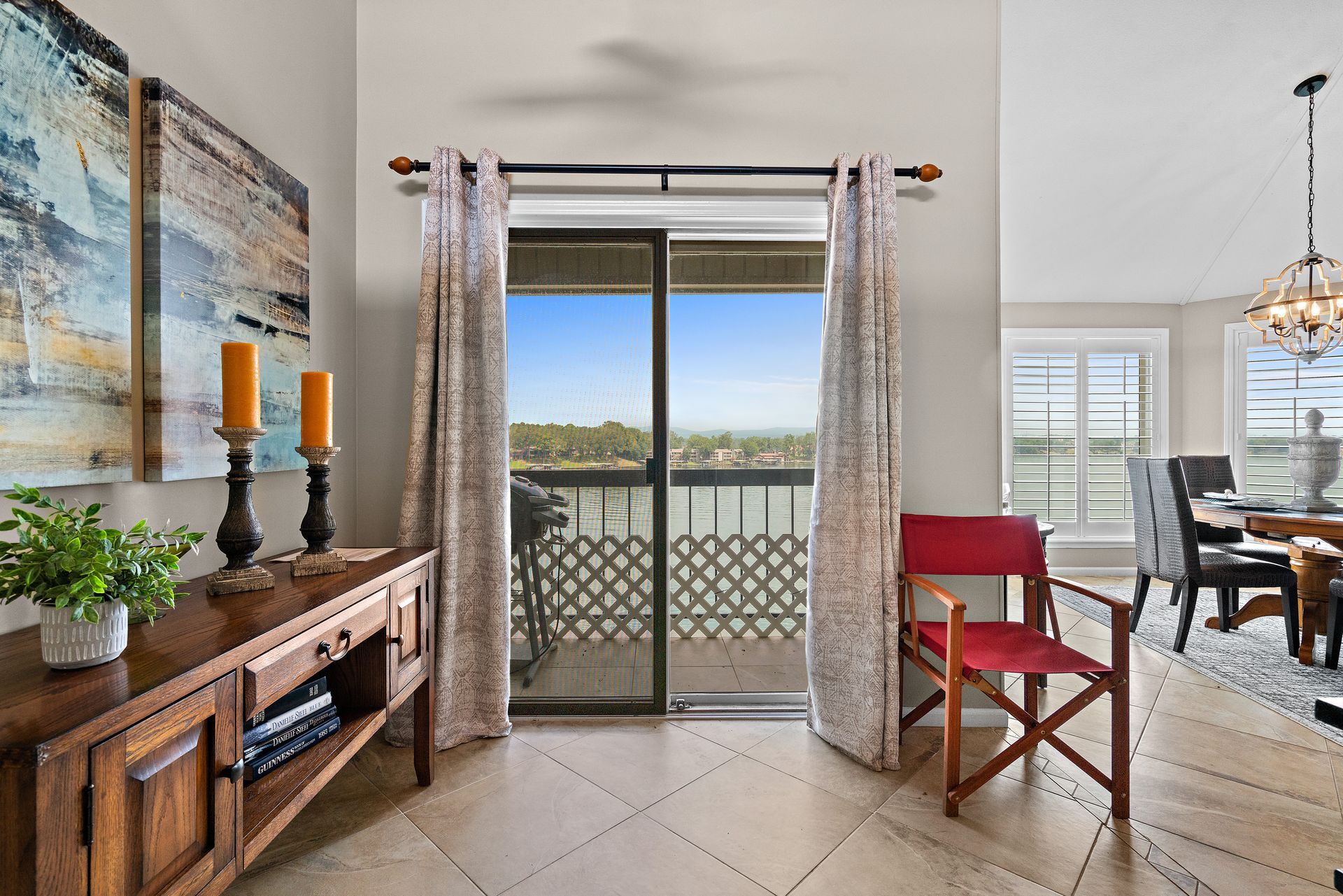 A living room with a sliding glass door leading to a balcony.